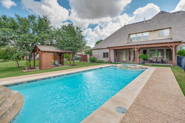 view of swimming pool with an outdoor structure, an in ground hot tub, a yard, a patio area, and a gazebo