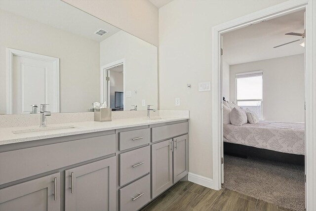 bathroom with ceiling fan and vanity