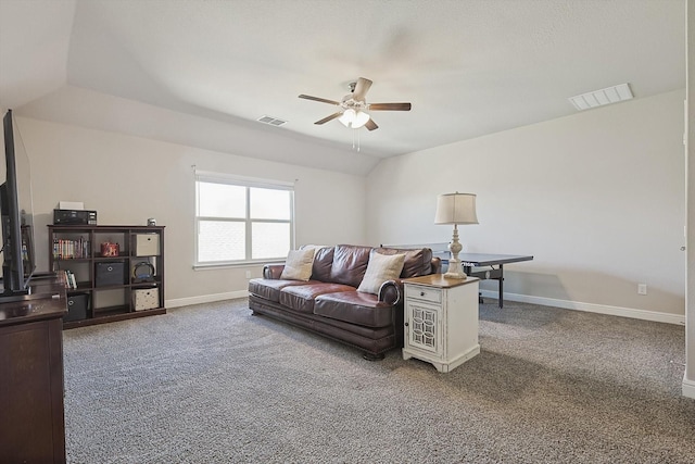 carpeted living area with a ceiling fan, lofted ceiling, baseboards, and visible vents