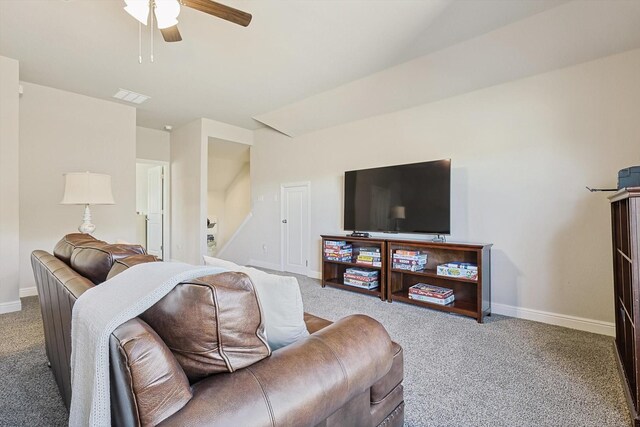 carpeted living area with visible vents, ceiling fan, and baseboards