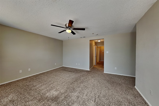 empty room featuring a textured ceiling and carpet floors