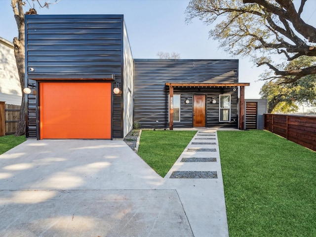 modern home featuring a front yard