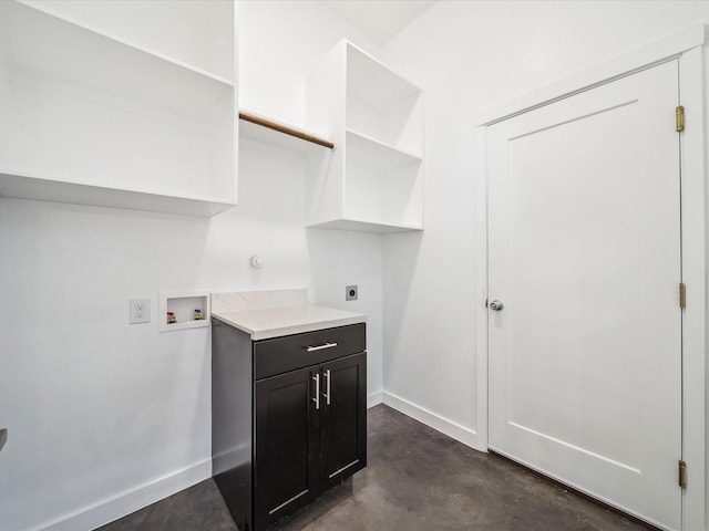 washroom with washer hookup, electric dryer hookup, and cabinets