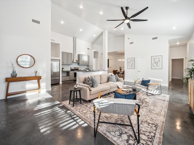 living room featuring ceiling fan with notable chandelier and high vaulted ceiling