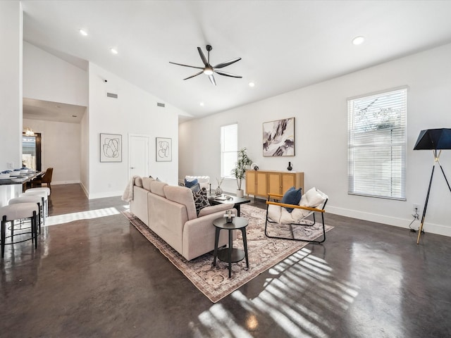 living room with vaulted ceiling and ceiling fan