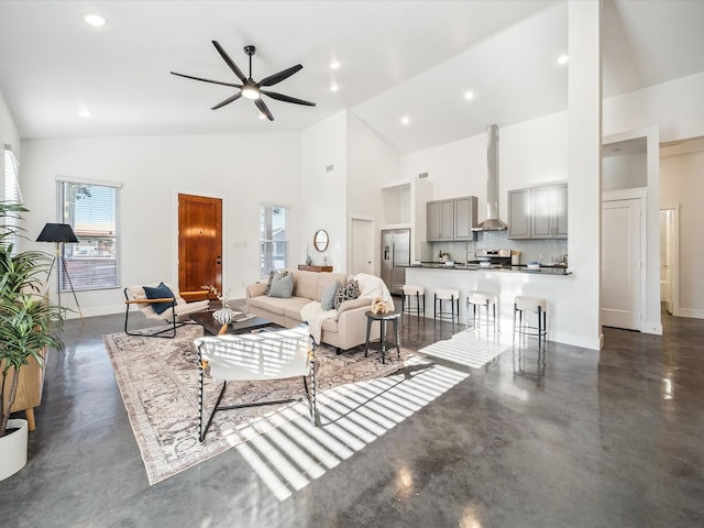 living room featuring high vaulted ceiling and ceiling fan