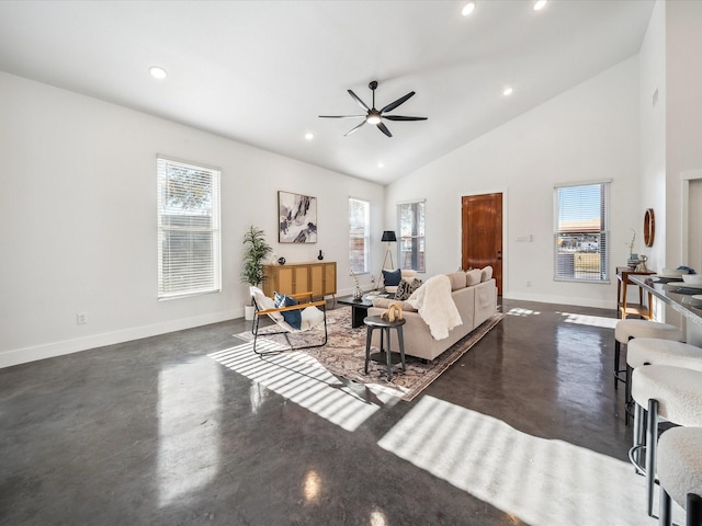 living room featuring ceiling fan, plenty of natural light, and high vaulted ceiling