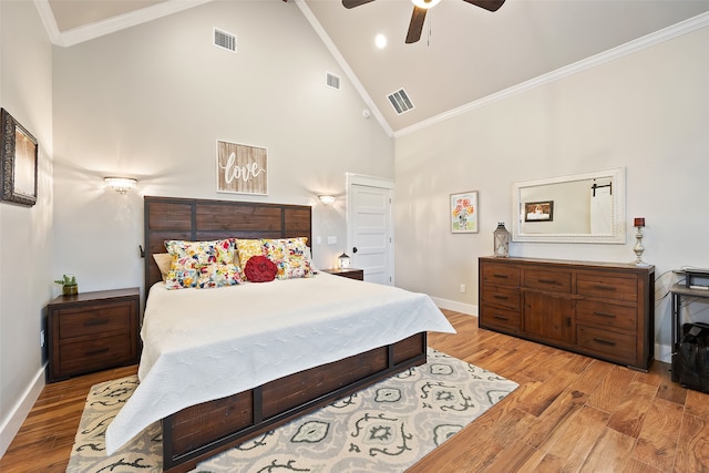 bedroom featuring ornamental molding, high vaulted ceiling, ceiling fan, and light hardwood / wood-style flooring