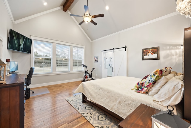 bedroom featuring light hardwood / wood-style flooring, ceiling fan, ornamental molding, a barn door, and beamed ceiling