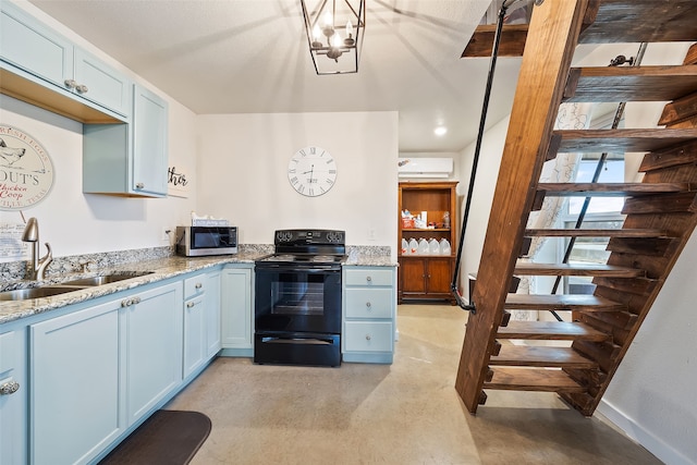 kitchen featuring blue cabinets, sink, light stone counters, black electric range, and a wall unit AC