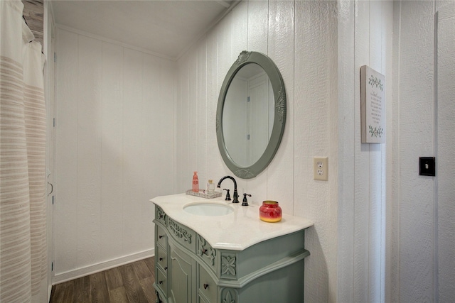 bathroom with hardwood / wood-style floors and vanity