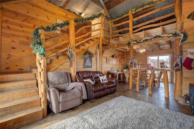 living room with concrete floors and wood walls