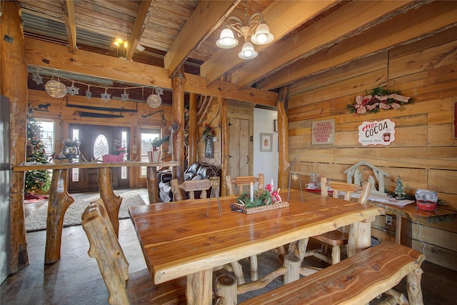 dining area with a notable chandelier, beam ceiling, wood ceiling, and wooden walls