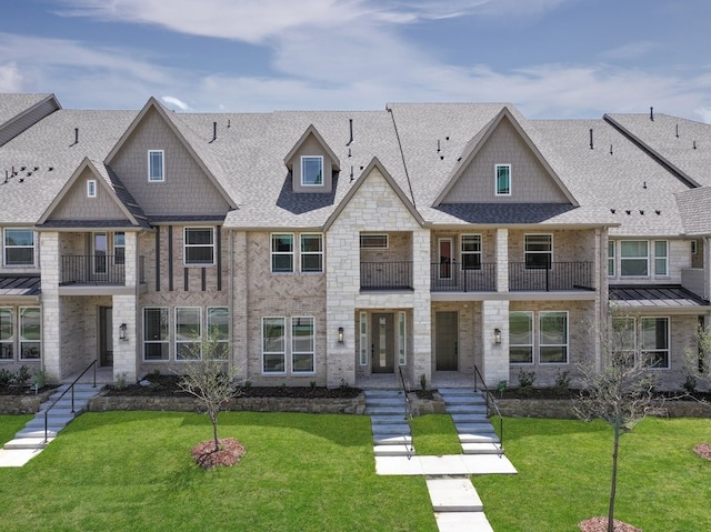 1804 Wittington Pl, Farmers Branch, TX 75234 - view of property with a balcony, a shingled roof, a front lawn, and brick siding