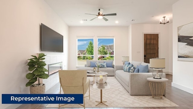 1804 Wittington Pl, Farmers Branch, TX 75234 - living area with wood finished floors, ceiling fan, a chandelier, baseboards, and recessed lighting