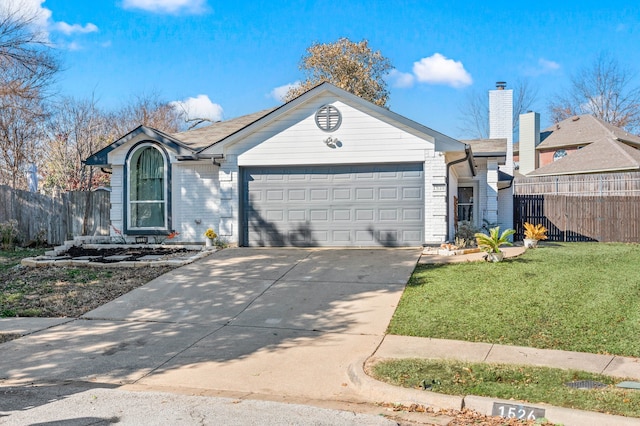 ranch-style home with a garage and a front yard