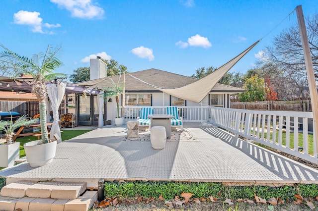 back of property featuring a pergola