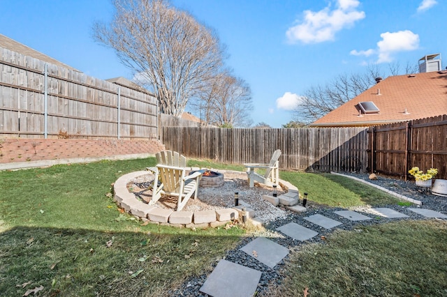 view of yard with a fire pit