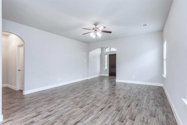 spare room with ceiling fan and light hardwood / wood-style floors