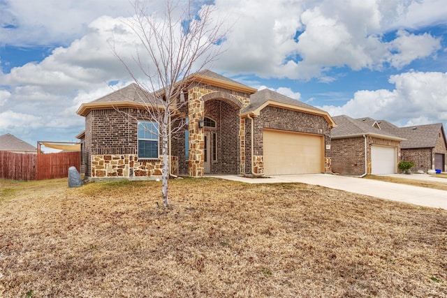 view of front of house with a garage and a front lawn