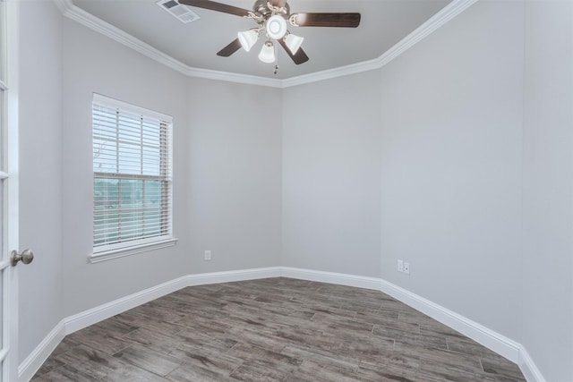 empty room featuring ceiling fan, crown molding, and wood-type flooring