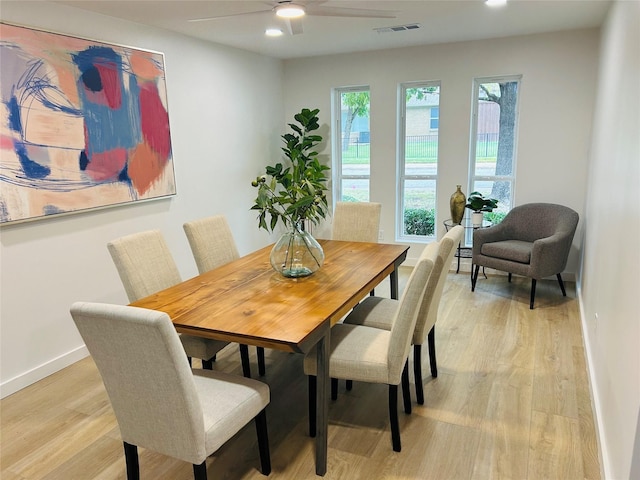 dining room featuring light hardwood / wood-style floors and ceiling fan