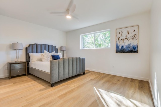 bedroom with ceiling fan and wood-type flooring