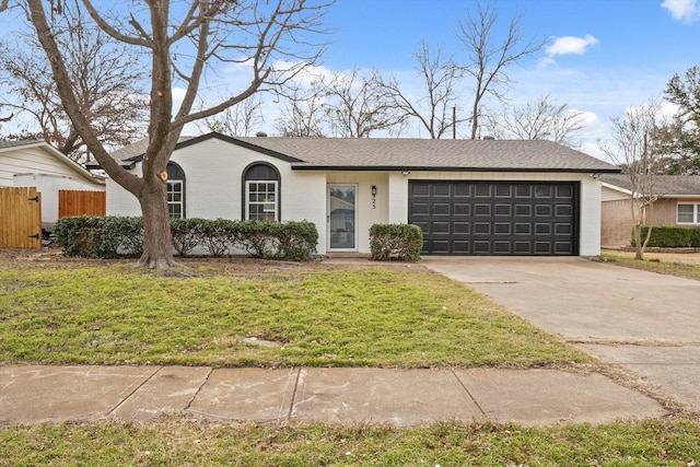 single story home with a garage and a front yard