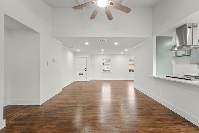 unfurnished living room with dark wood-type flooring and ceiling fan