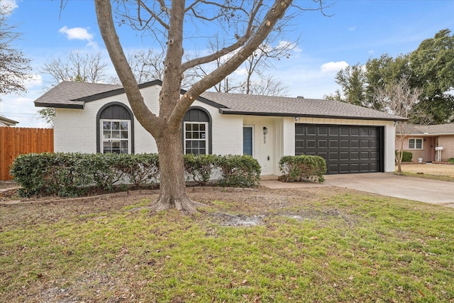 single story home with a garage and a front yard