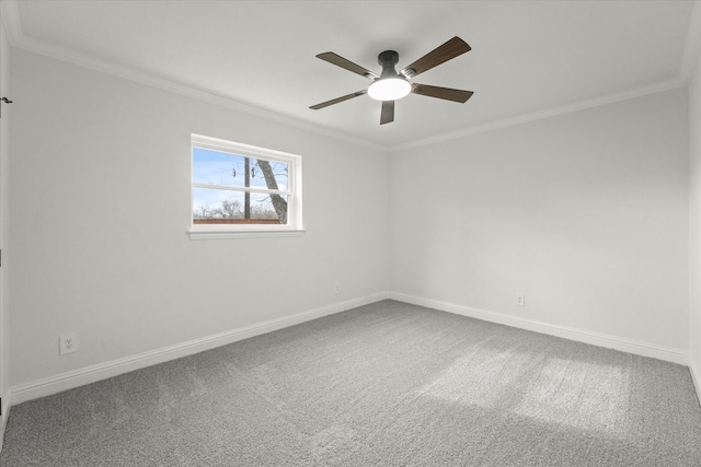 carpeted empty room with ceiling fan and ornamental molding