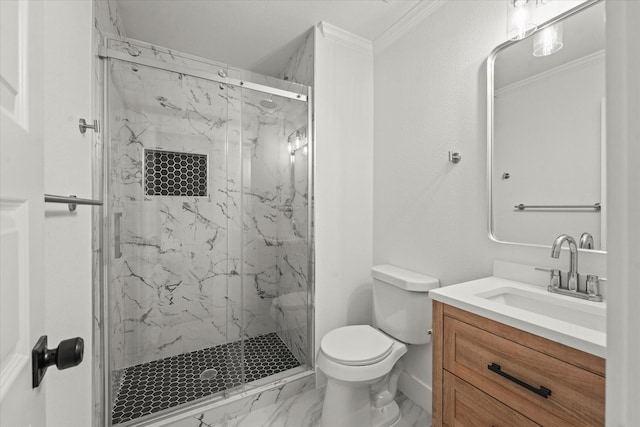 bathroom with vanity, toilet, ornamental molding, and a shower with shower door