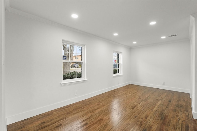 unfurnished room featuring dark hardwood / wood-style flooring and ornamental molding