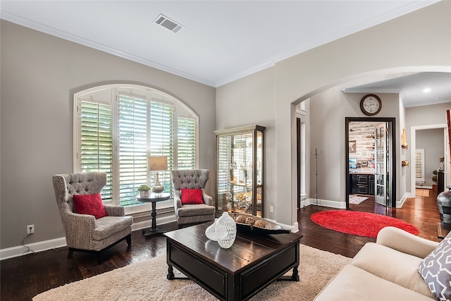 living room with crown molding and dark hardwood / wood-style flooring