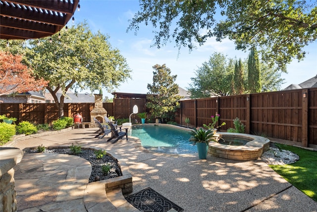 view of swimming pool featuring a patio area, an in ground hot tub, and an outdoor stone fireplace