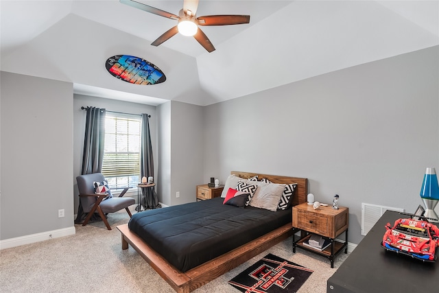 carpeted bedroom featuring ceiling fan and vaulted ceiling