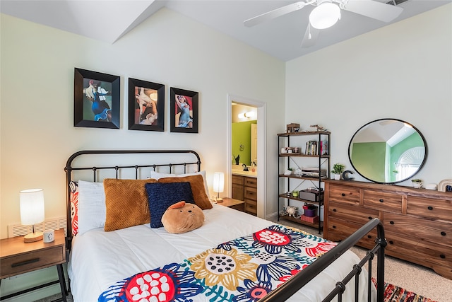 carpeted bedroom featuring connected bathroom and ceiling fan