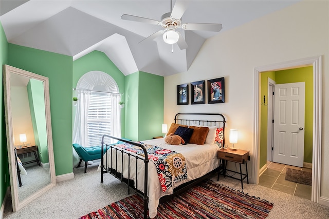 bedroom featuring ceiling fan, lofted ceiling, and light carpet