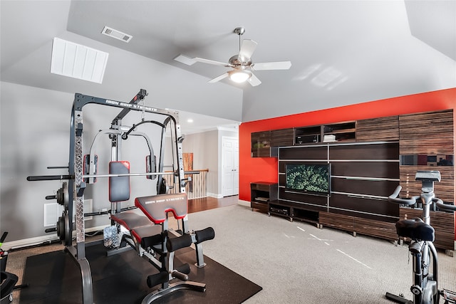 workout area featuring ceiling fan, carpet floors, and lofted ceiling