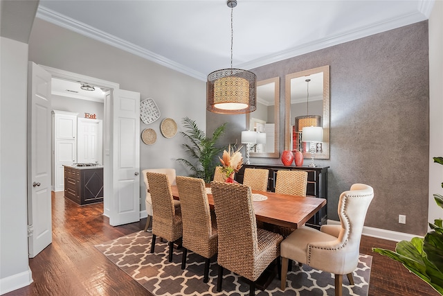 dining area featuring ornamental molding and dark wood-type flooring