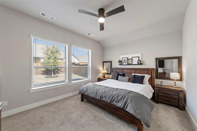 bedroom featuring vaulted ceiling, light colored carpet, and ceiling fan