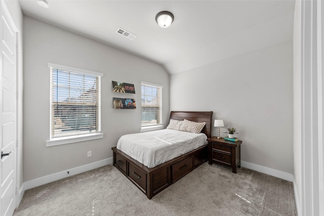 carpeted bedroom featuring vaulted ceiling