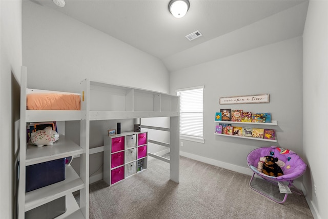 carpeted bedroom featuring vaulted ceiling