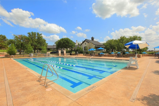 view of swimming pool featuring a patio