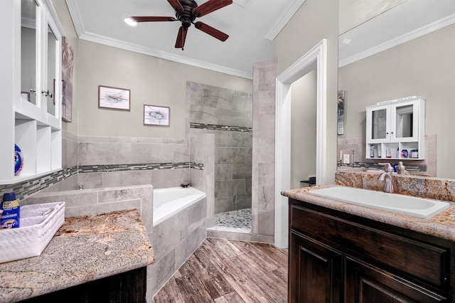 bathroom with ceiling fan, vanity, crown molding, and independent shower and bath