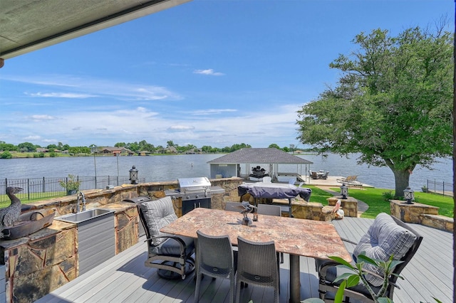 deck featuring sink and a water view