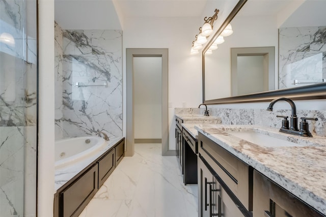 bathroom with vanity and a relaxing tiled tub