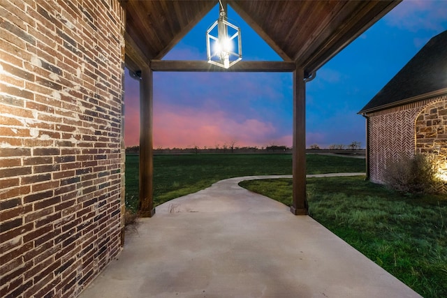 patio terrace at dusk with a yard