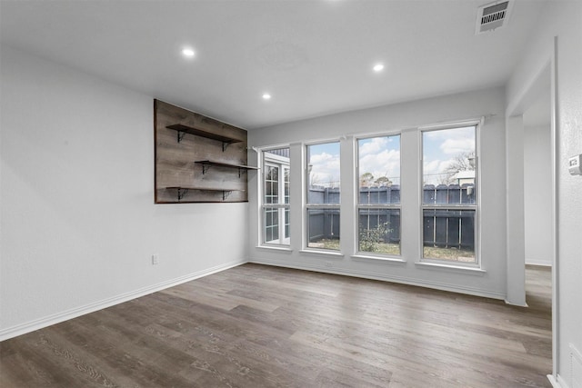 empty room with wood-type flooring