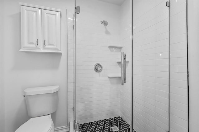 bathroom with toilet and walk in shower